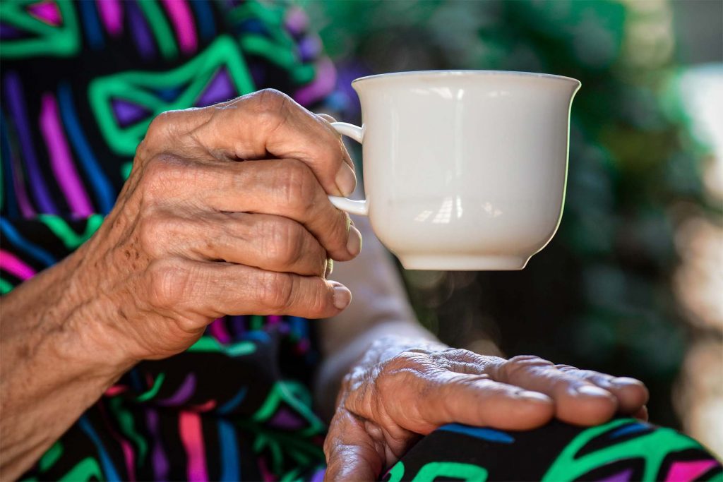 Holding a cup of tea