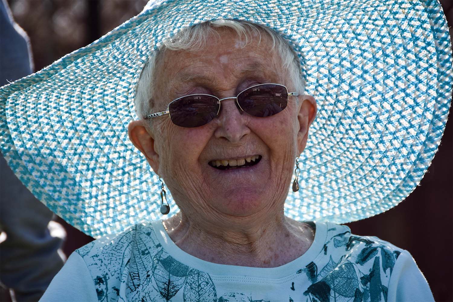 Happy resident in blue hat 
